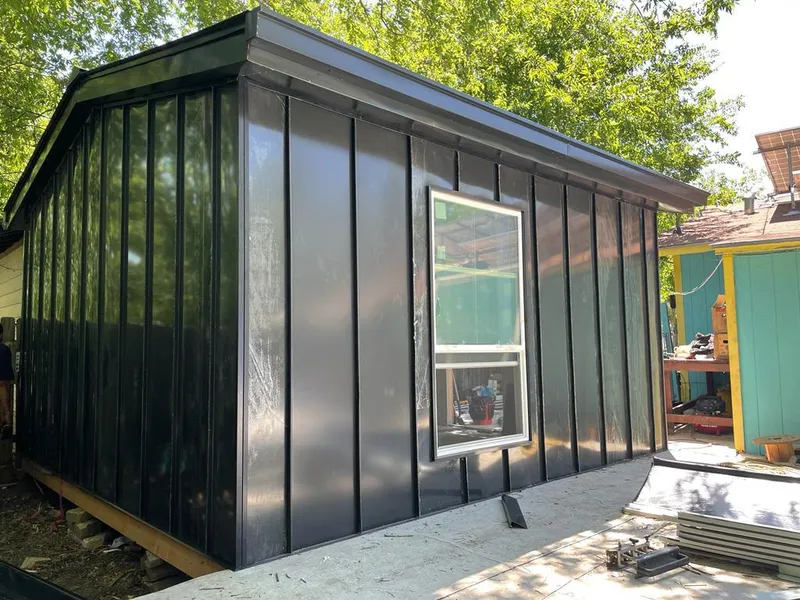 Black standing seam metal wall panels for Roof Inspection in Bolton